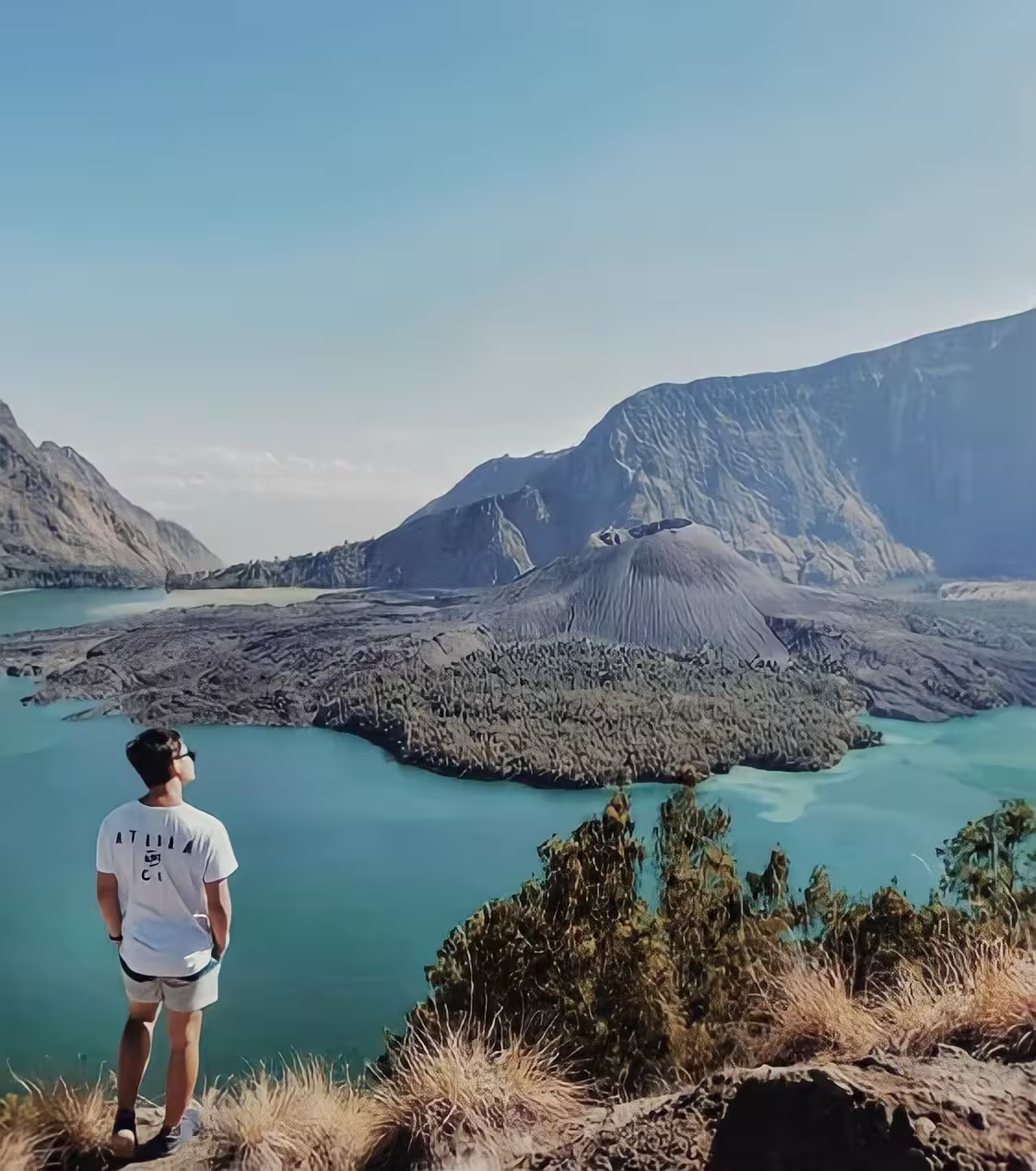 Spectacular panoramic views over Segara Anak lake and Rinjani's massive volcanic caldera