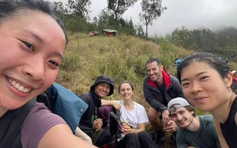 A group of hikers takes a selfie on Mount Rinjani during a 3-day trek along the Sembalun route A group of hikers takes a selfie on Mount Rinjani during a 3-day trek along the Sembalun route