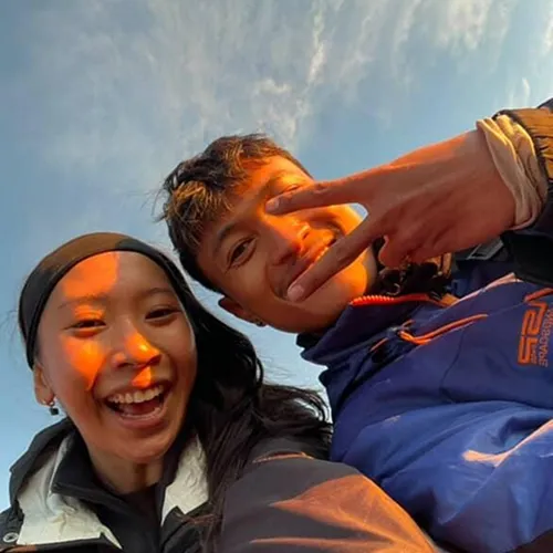 A man and woman take a selfie at sunrise on Mount Rinjani during their 3-day trek along the Sembalun route A man and woman take a selfie at sunrise on Mount Rinjani during their 3-day trek along the Sembalun route